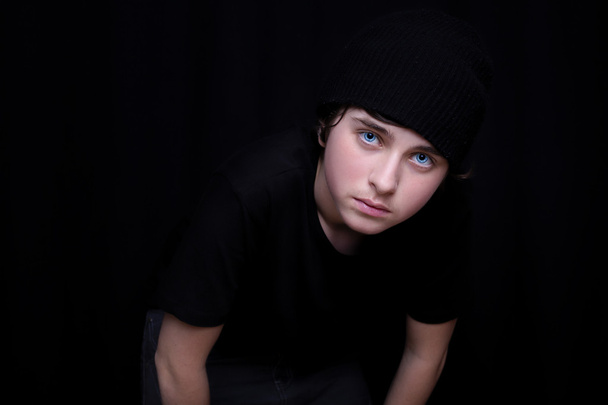 Portrait of a teen boy in a black cap - 写真・画像
