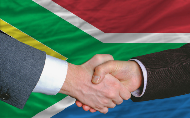 Uomini d'affari stretta di mano dopo un buon affare di fronte al Sud Africa f
 - Foto, immagini