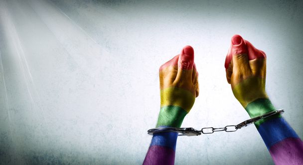手錠をかけられ手 - 同性愛の犯罪の通告 - 写真・画像