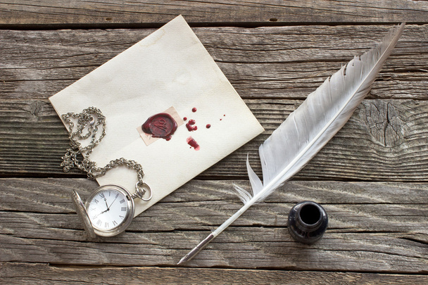 Wax sealed letter with quill on wooden background - Foto, imagen