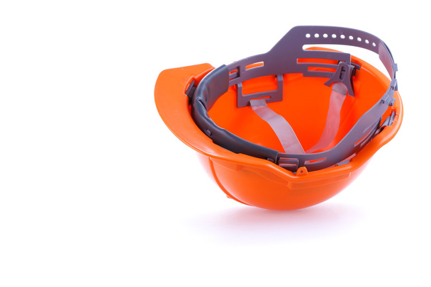 Oranje veiligheid helm harde hoed, hulpprogramma beschermen werknemer van gevaar - Foto, afbeelding