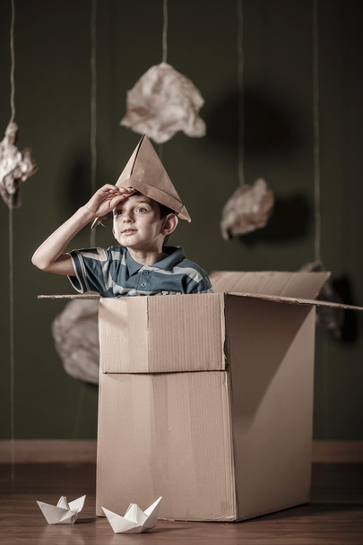 Boy with paper hat - Φωτογραφία, εικόνα