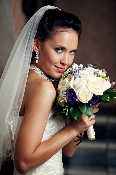 Young happy bride with flowers - Foto, imagen