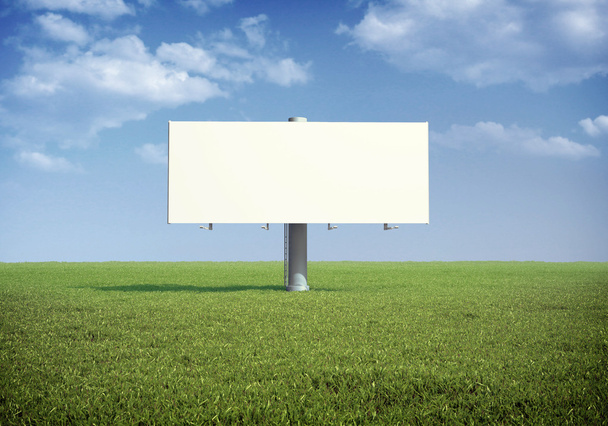 Рекламный щит, стоящий на травяном поле - Фото, изображение