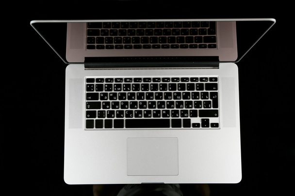 Laptop on dark background - Фото, изображение