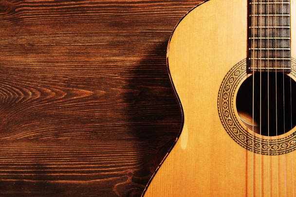 Acoustic guitar on wooden background - 写真・画像