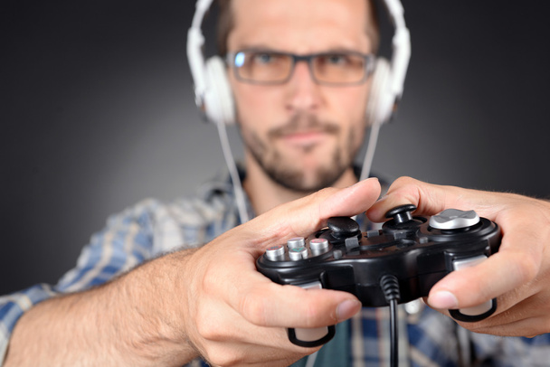 Young man playing video games - Photo, image