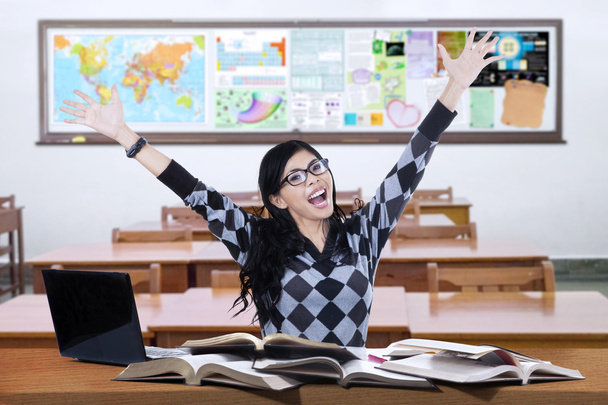 Cheerful learner raise hands in the class - Fotografie, Obrázek