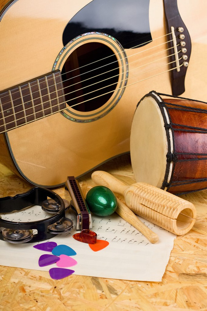 Several music instruments on OSB board - Foto, afbeelding