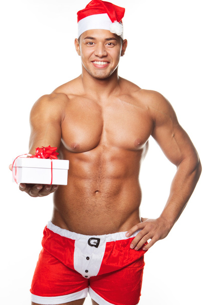 afbeelding van sexy man draagt santa claus kostuum - Foto, afbeelding
