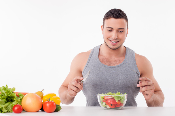 Attractive young man wants to eat healthy food - Фото, изображение