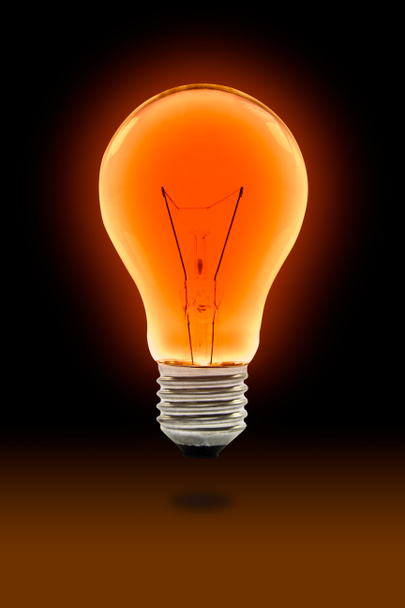 Orange light bulb - Foto, afbeelding
