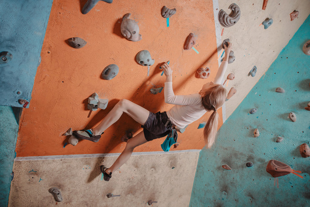 Climber girl training in gym - Photo, image