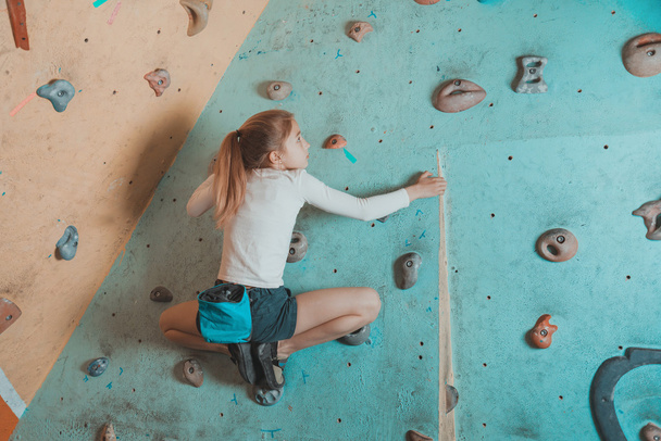 Climber little girl exercises in gym - 写真・画像