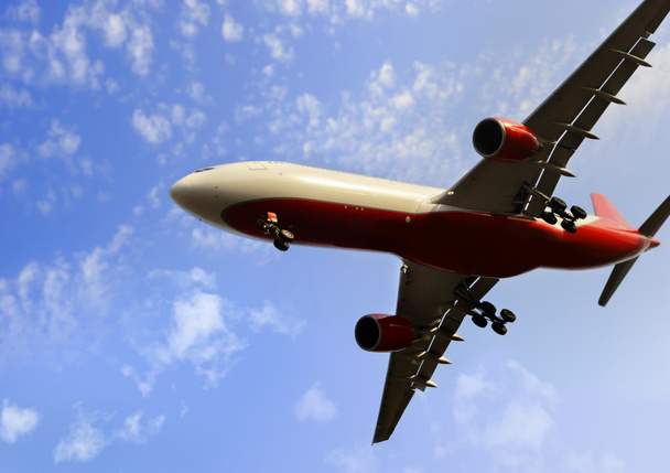 commercial flight airplane flying on blue sky in travel tourism concept - Photo, Image