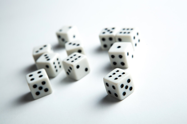cubes with numbers scattered on a white background - Photo, Image
