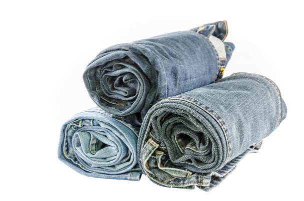 roll blue denim jeans arranged in stack - Photo, Image