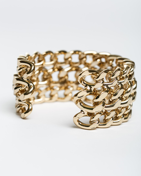 a pulseira dourada
 - Foto, Imagem
