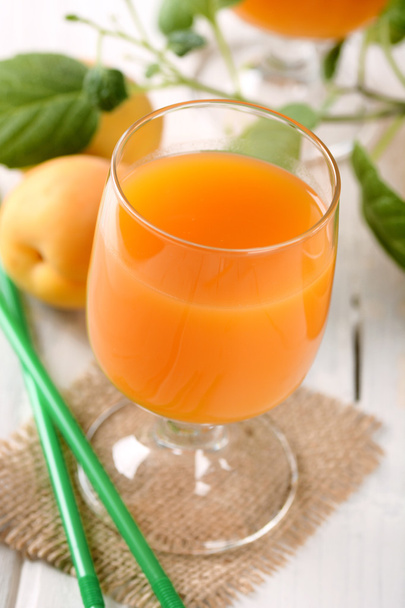 apricot juice in the glass - Фото, изображение