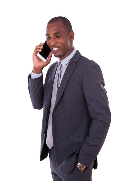 Portrait of a young African American business man making a mobil - Photo, Image
