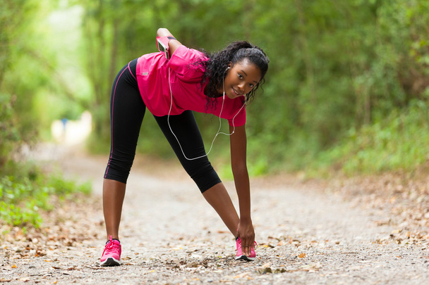  African american woman jogger stretching  - Fitness, people and - Foto, Imagem