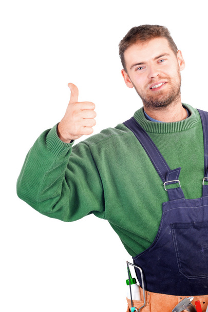 Real handsome carpenter showing thumb up - Photo, image