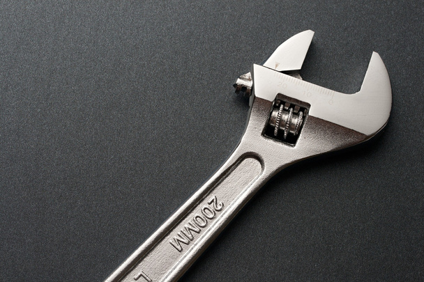 Spanner on a grey background - Foto, afbeelding