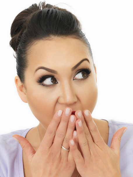 Portrait Of A Very Shocked And Surprised Beautiful Young Hispanic Woman Covering Her Mouth With Her Hands - Photo, Image