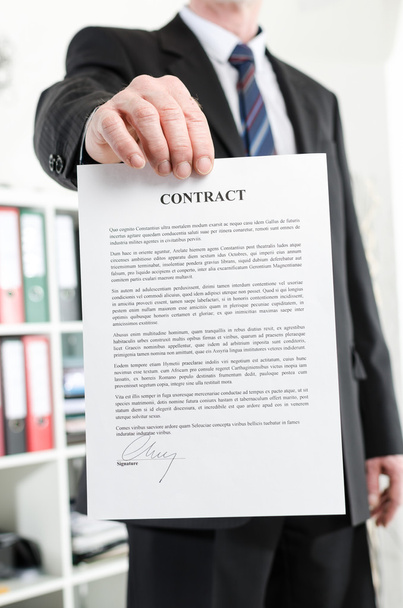 Businessman holding a contract - Photo, Image