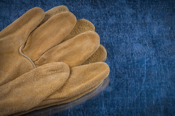 Pair of leather brown protective gloves - Φωτογραφία, εικόνα