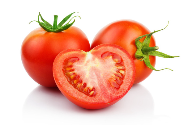 Red tomatoes with cut isolated on white - 写真・画像