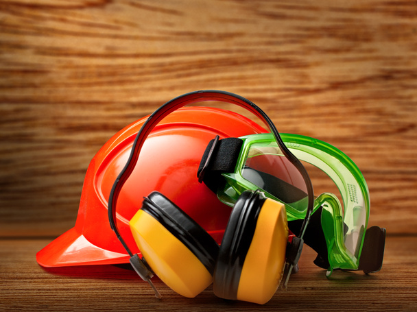 Red helmet with earphones and goggles - Photo, Image