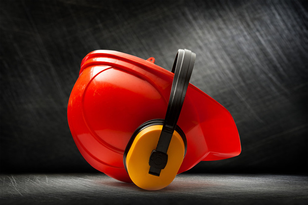 Red safety helmet with earphones - Photo, Image