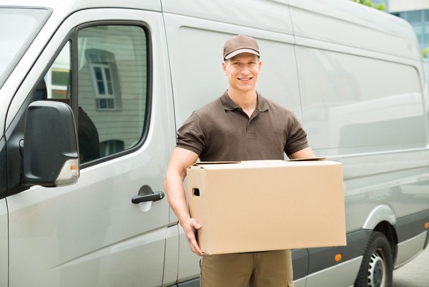Delivery Man Holding Box - Fotó, kép