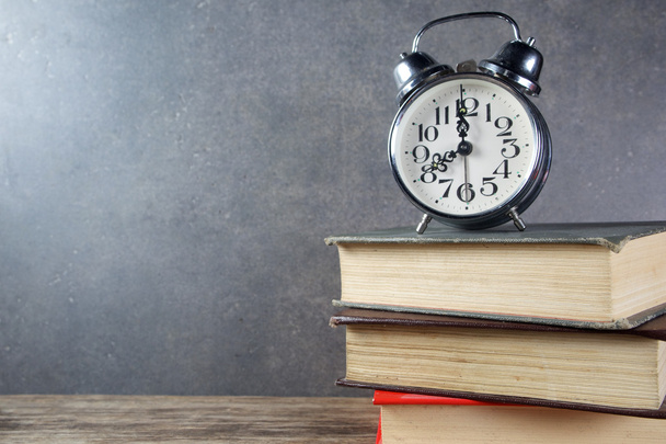 Back to school background with books and alarm clock - Foto, Imagen
