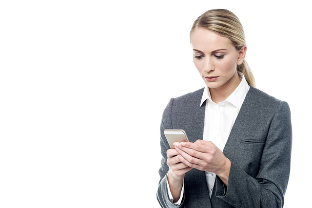 Businesswoman staring her mobile - Фото, зображення