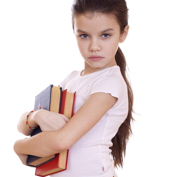 Education, Young beautiful schoolgirl holds textbooks - Photo, Image