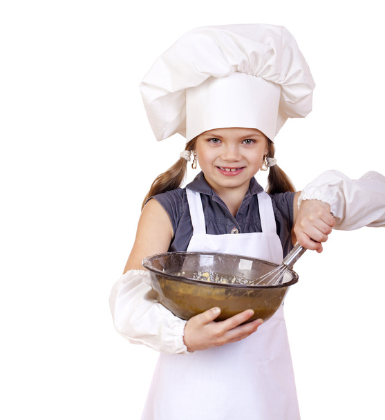 Little girl cook whips whisk eggs in a large plate - Zdjęcie, obraz