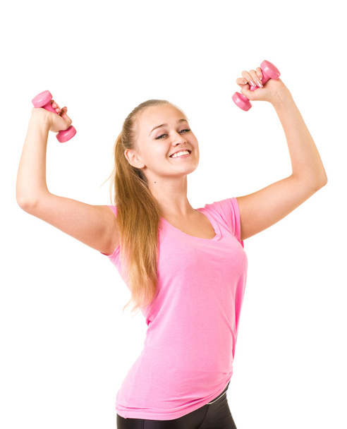 mosolygó lány edzőterem súlyzókkal felszerelt - Fotó, kép