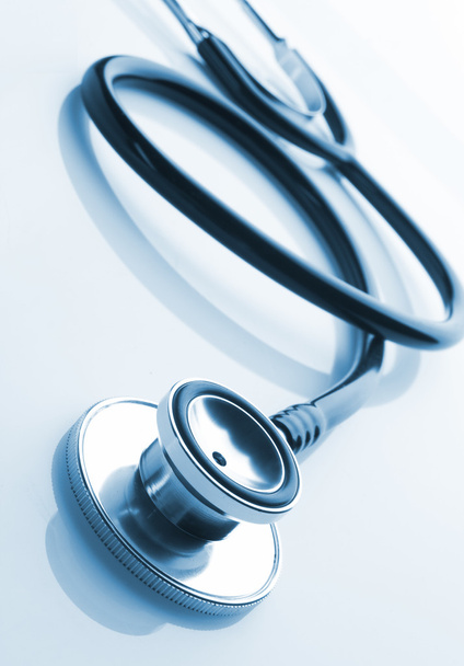 Medical Stethoscope Twisted In Heart Shape Lying On Patient Medical History  List And Blue Doctor Uniform Closeup Stock Photo, Picture and Royalty Free  Image. Image 80480566.