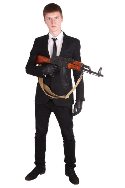 man in black suit and ak 47 - Photo, image