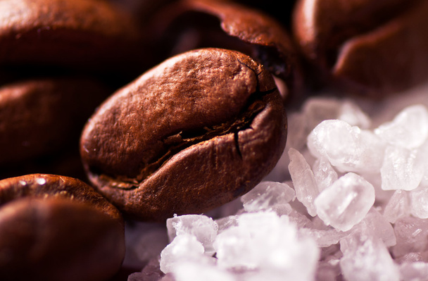 Coffee beans on sugar granules - Photo, Image