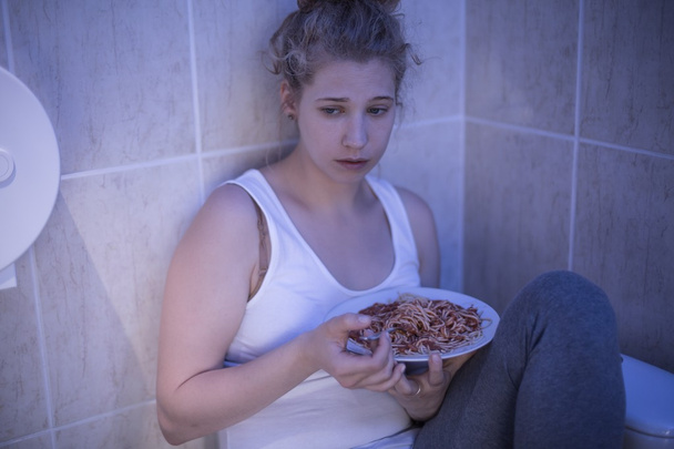 Overeating sad girl - Fotoğraf, Görsel