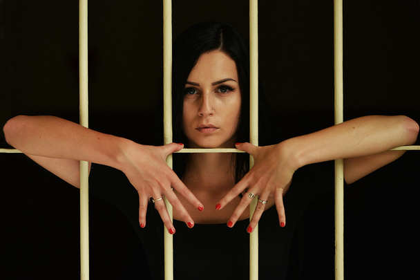 Woman behind the bars - Photo, Image