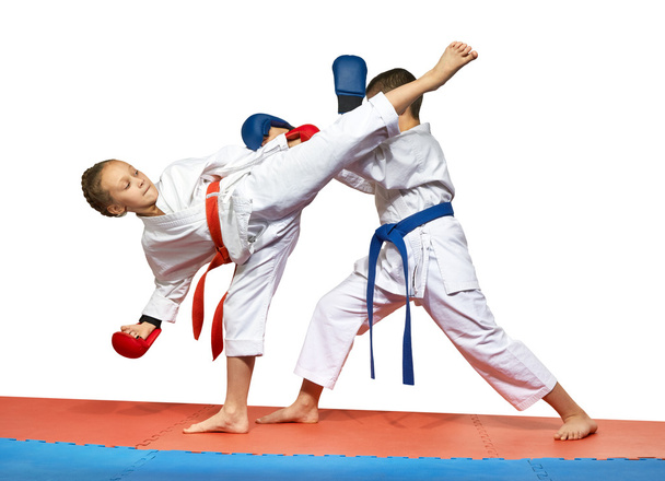 Two young athlete doing exercise paired karate - Photo, Image