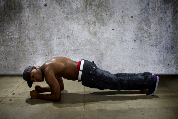 male doing push ups on a concrete - Фото, изображение