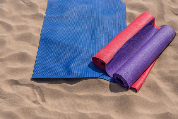 Yoga mats thrown on the beach - preparing for the lesson - Photo, Image