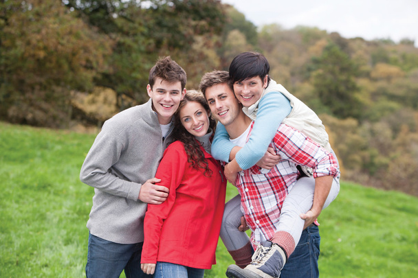 Four friends posing outdoors - Φωτογραφία, εικόνα