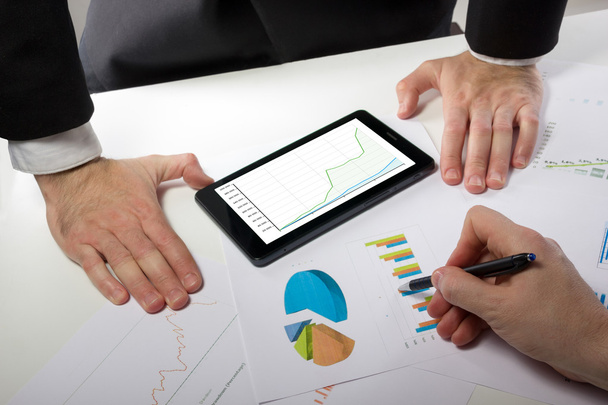 Business people on a meeting analyzing financial reports - Zdjęcie, obraz