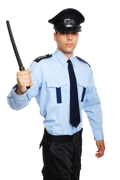 Policeman holds nightstick in hands - 写真・画像